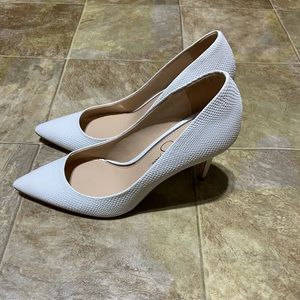 White pointed toe pumps